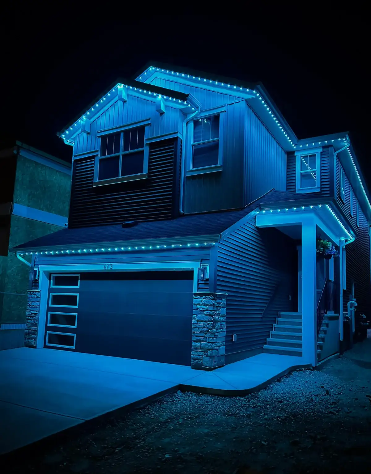 Cyan permanent outdoor lighting scene on an Edmonton home