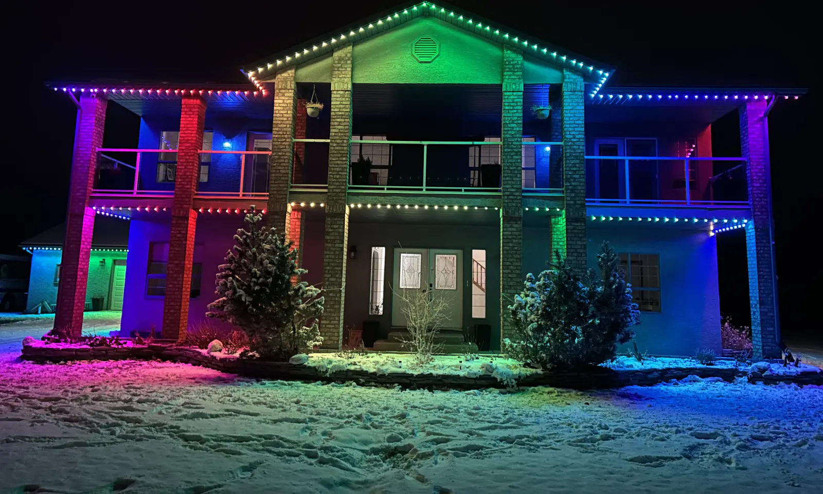 Permanent Christmas lights on Edmonton home at night