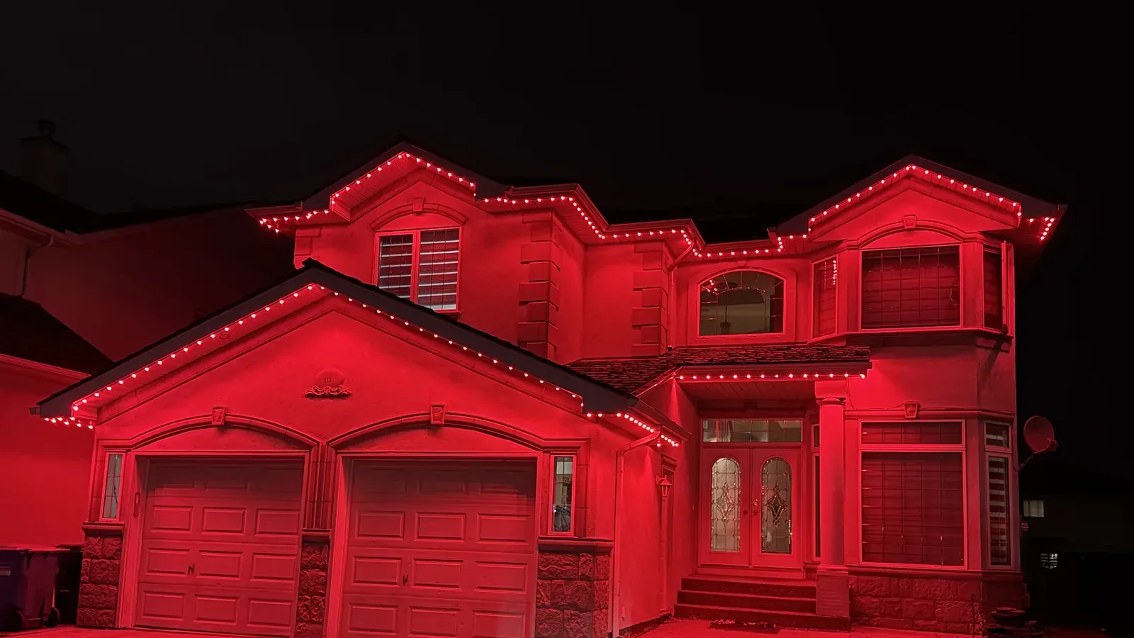 Colourful permanent Christmas lighting scene on an Edmonton home