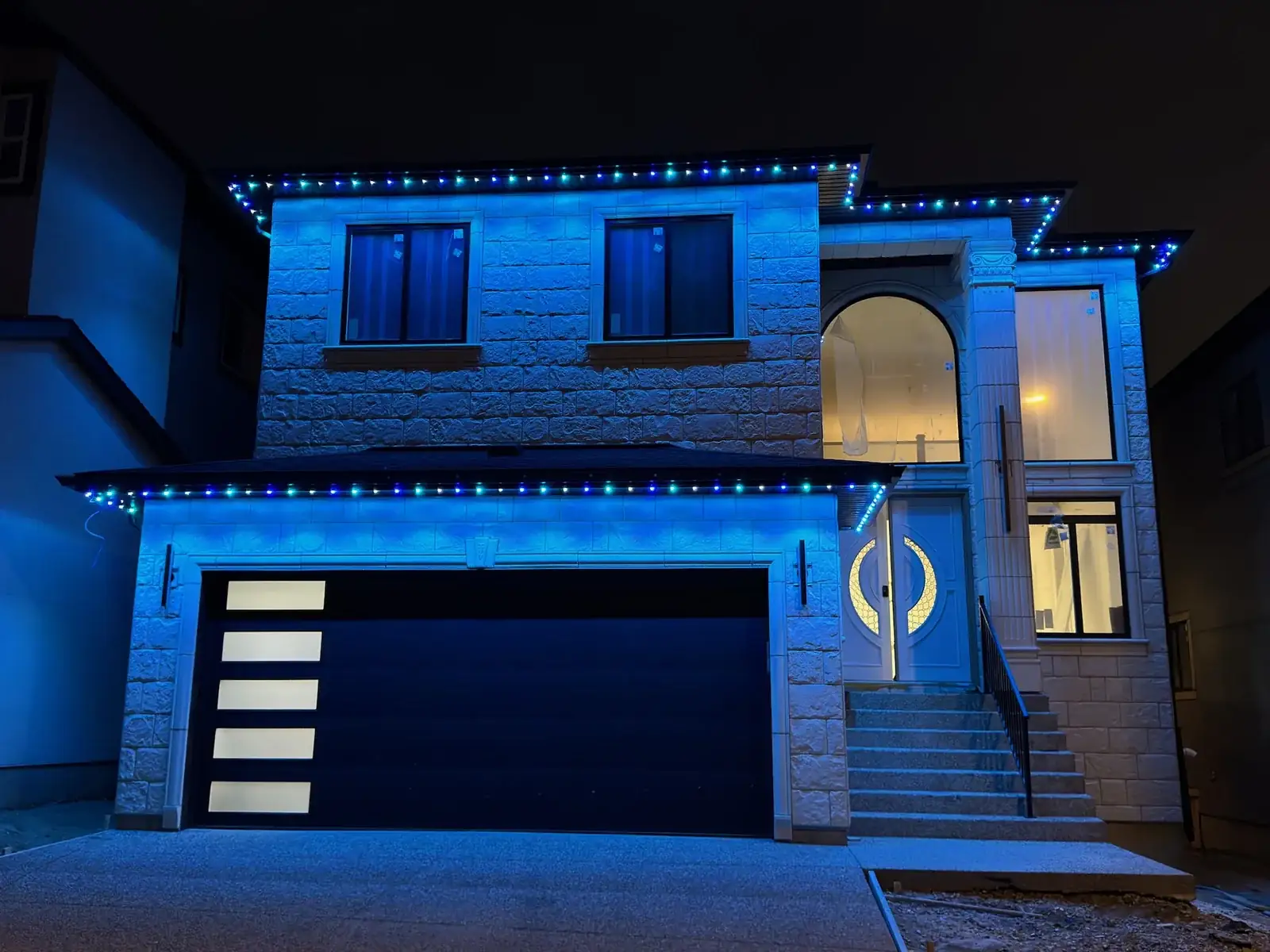 Blue permanent lighting on an Edmonton home