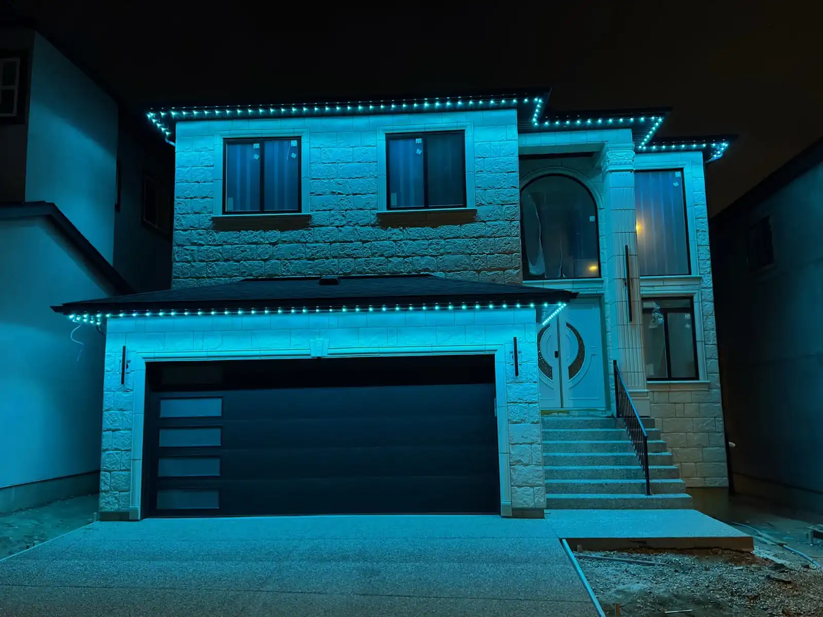 Cyan permanent lighting on an Edmonton home