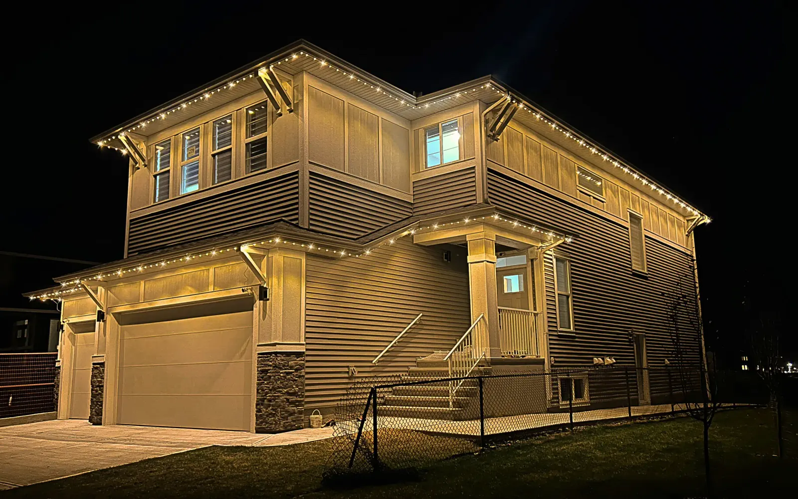 Beautiful Edmonton home with permanent outdoor LED lighting at night