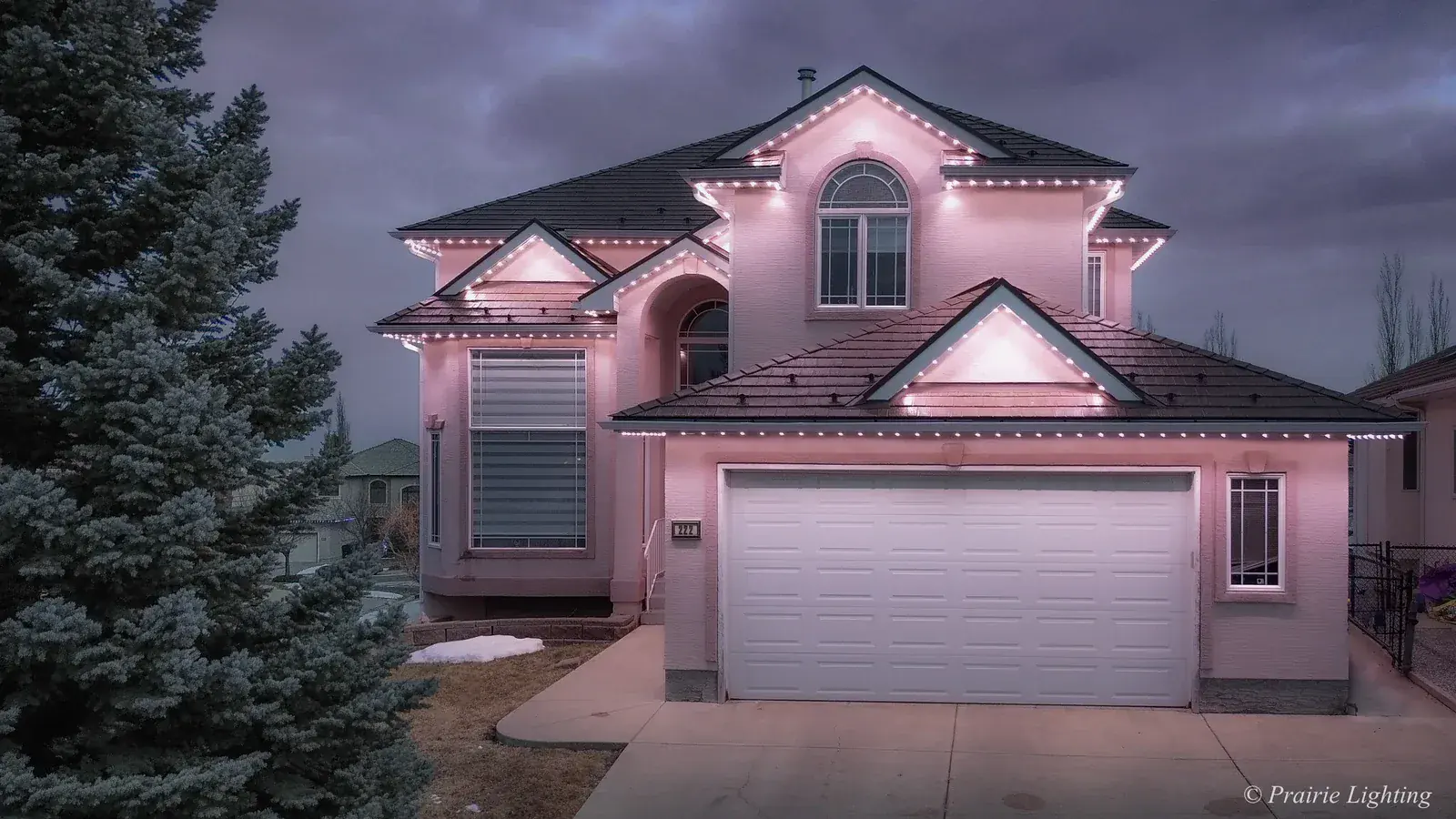 Prairie Lighting permanent outdoor LED installation with pink lighting on an Edmonton home