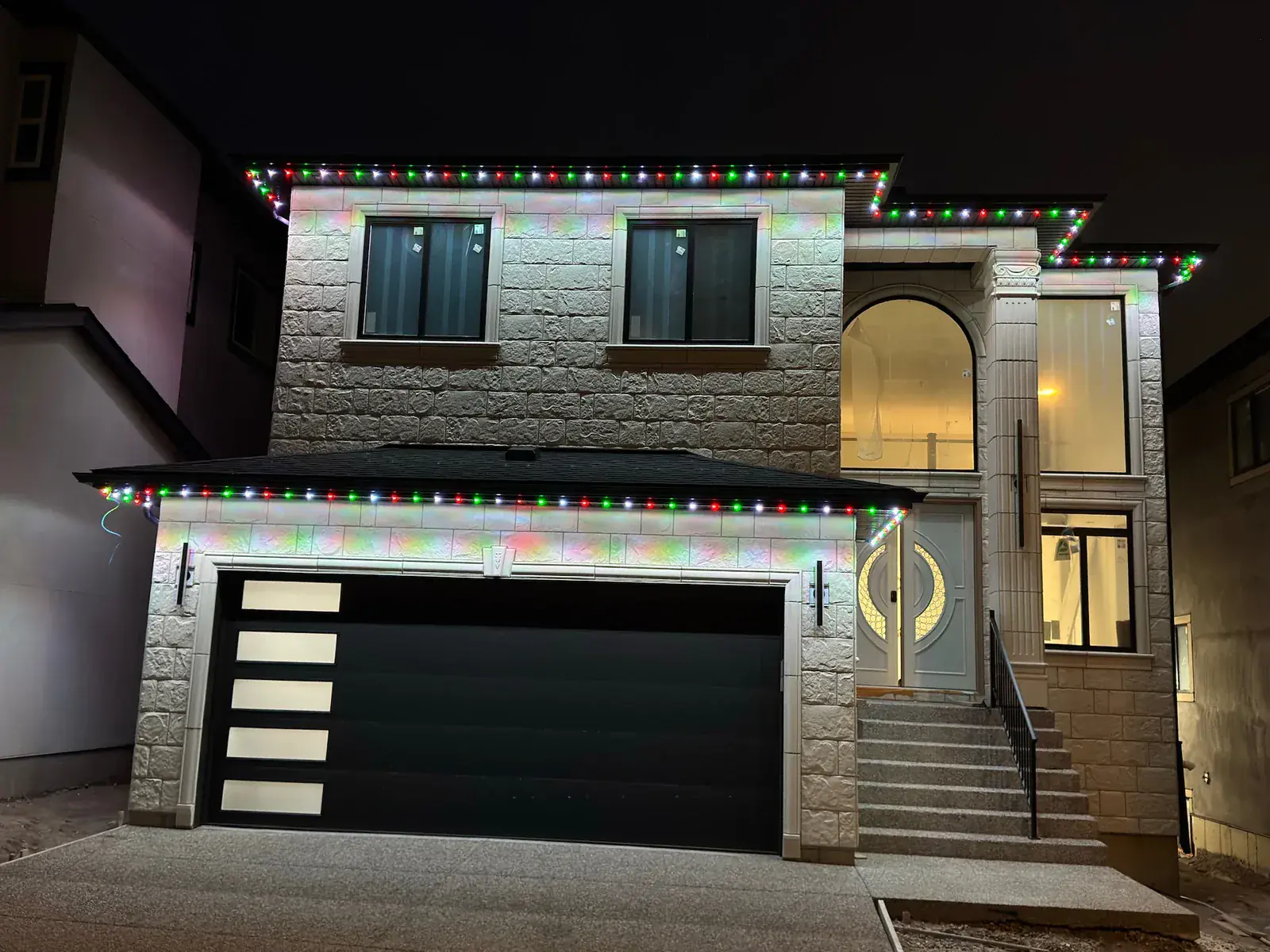 One Edmonton home lit in a different colour 1