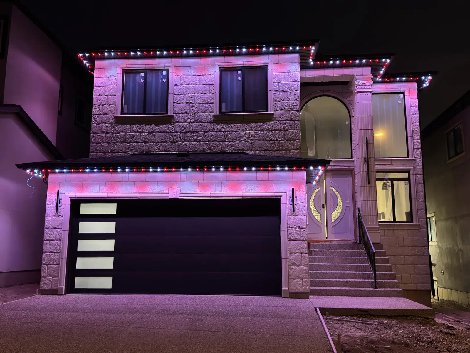 One Edmonton home lit in a different colour 2
