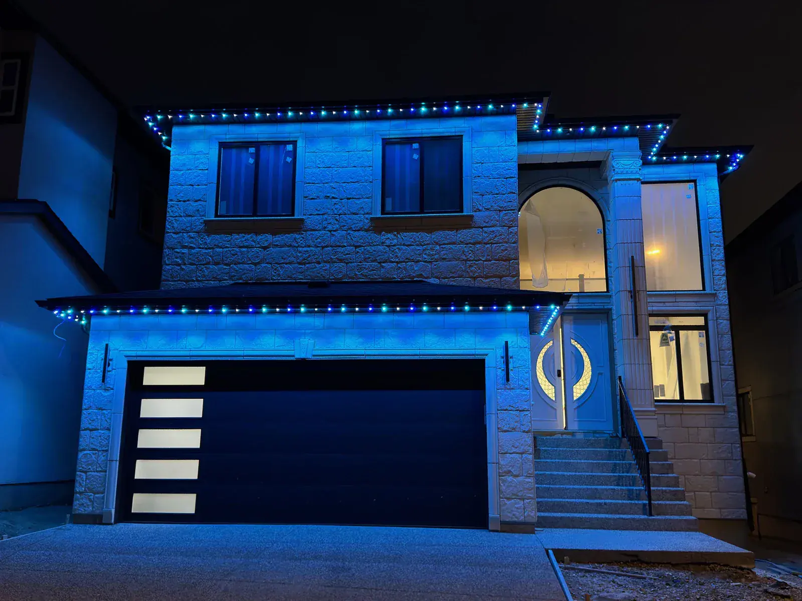 One Edmonton home lit in a different colour 3