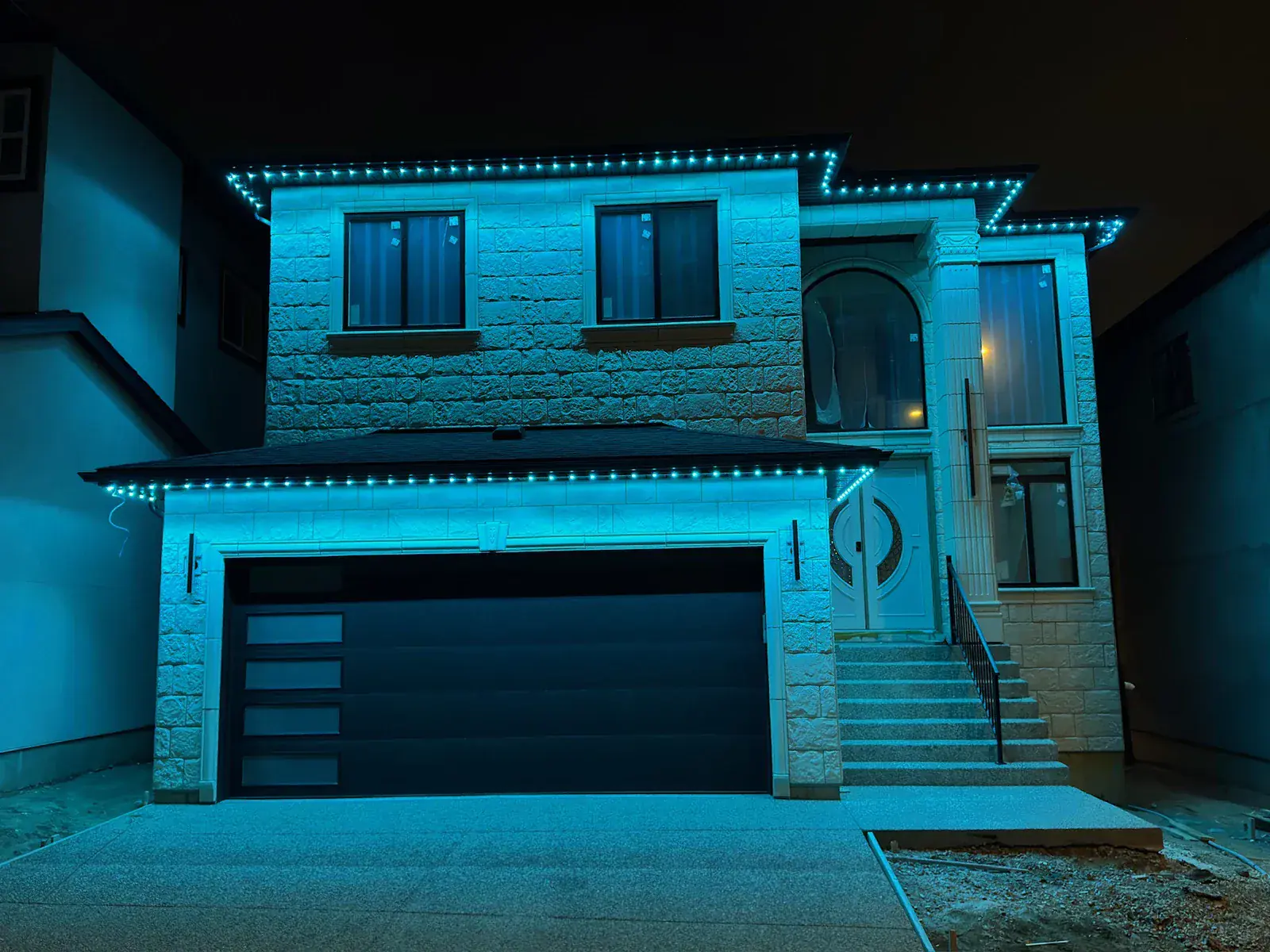 One Edmonton home lit in a different colour 6