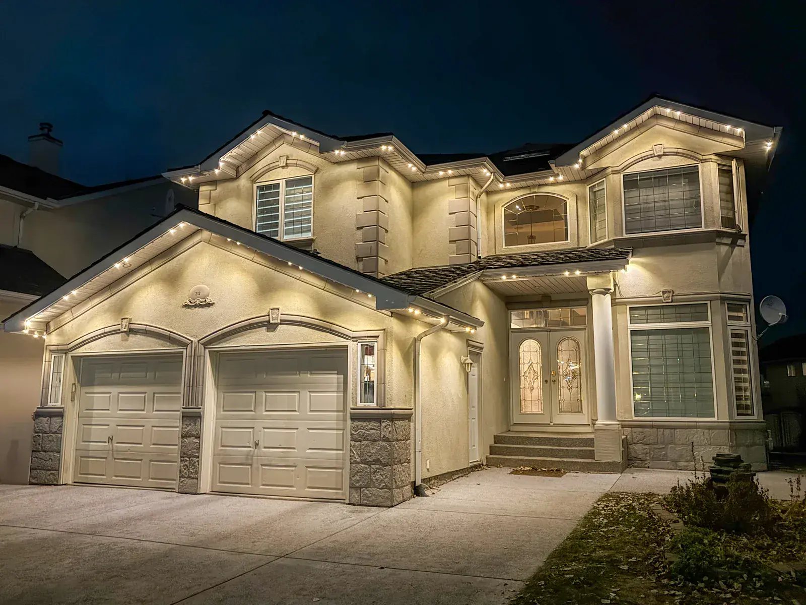 Permanent LED soffit lighting installed along an Edmonton home