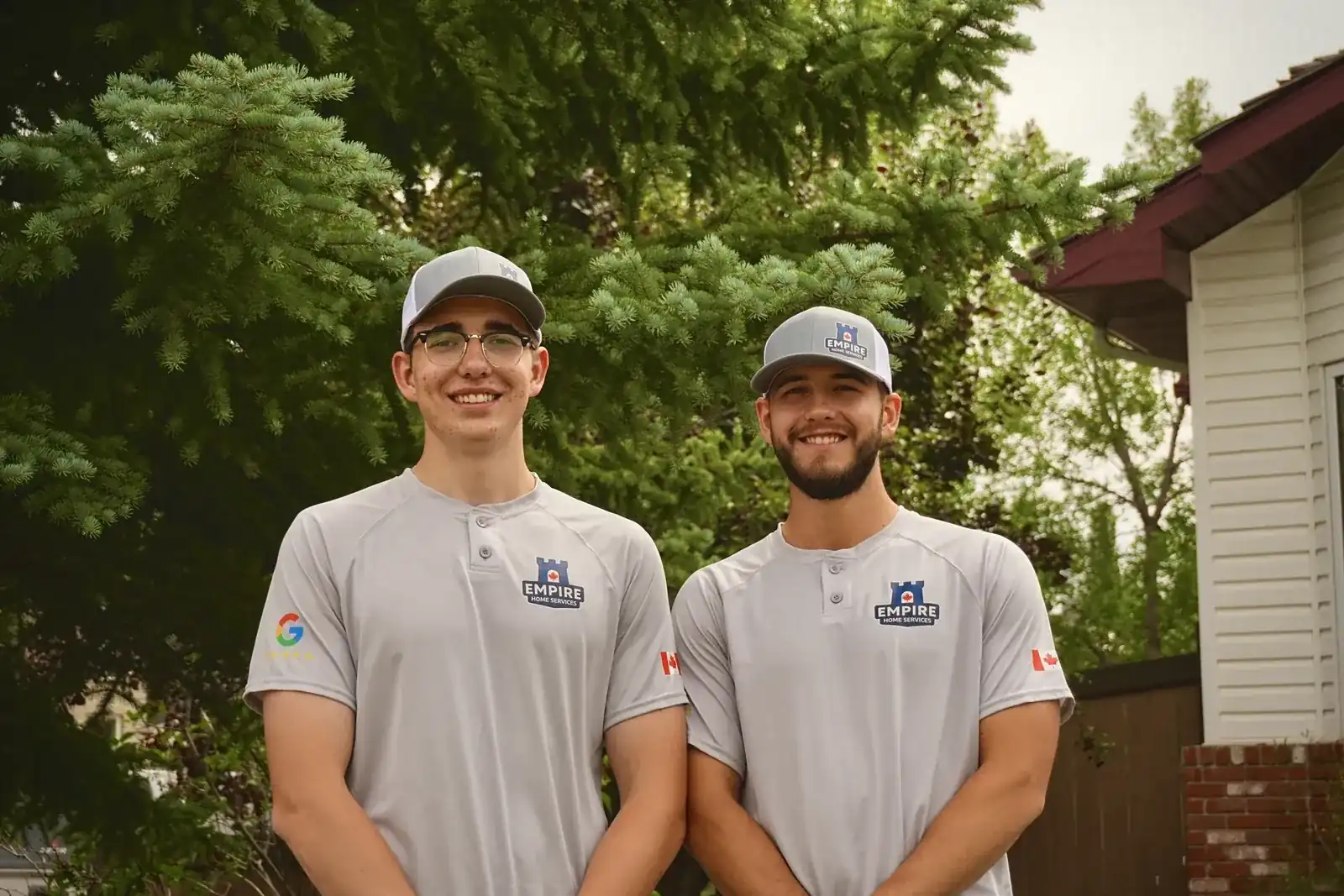 Empire Home Service founders in uniform outside an Edmonton home